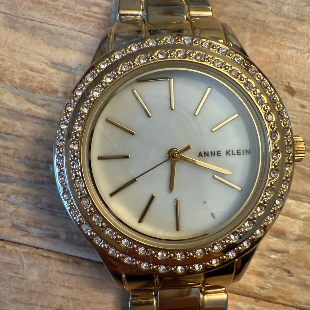 Anne Klein Gold-Tone Crystal Bezel Women's Watch with Mother-of-Pearl Dial